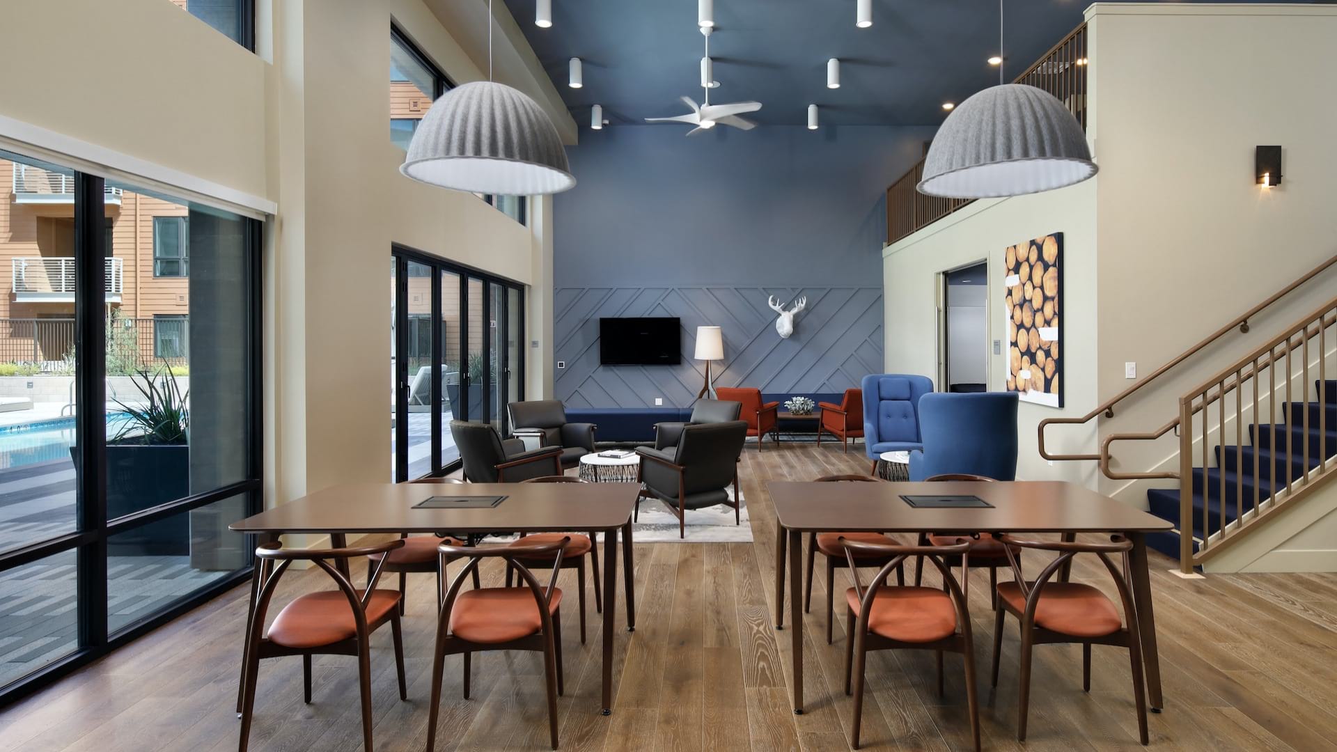 Open-Concept Lounge with Natural Lighting and Overlooking Swimming Pool